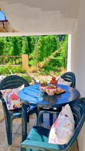 a blue table with bowls of food on it at Casa Vicente in Lamego