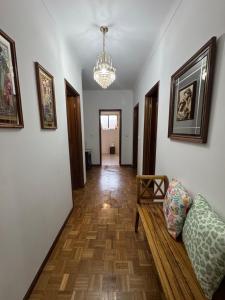 a living room with a couch and a chandelier at Casa Vicente in Lamego +67 photos