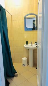 a bathroom with a sink and a mirror at Ulcinj apartments in Ulcinj