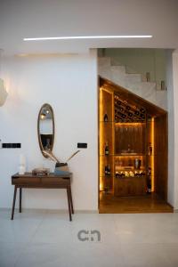 a room with a table and a mirror at Villa CICAS in Cotonou