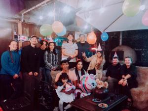 a group of people posing for a picture at a party at Il Riposo in Arequipa