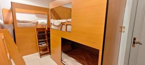 a small room with a closet with a fireplace at La Casa Beduina Hostel in Riyadh