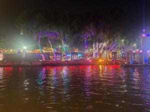 a view of a river at night with lights at Nangyang lodge in Malacca