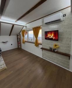a living room with a fireplace in the wall at Filip in Sarajevo