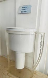 a glass pitcher sitting on a table with a sign at Barkerhouse 2# unit-heart of oldtown in Niagara-on-the-Lake +15 photos
