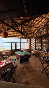 a billiard room with a pool table in a building at Pousada Recanto das Fontes in Beberibe