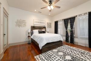 a bedroom with a bed and a ceiling fan at Uptown Merchant in Abilene