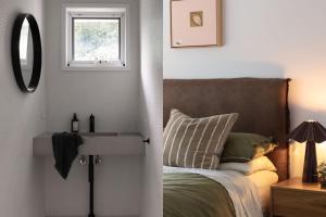 a bedroom with a bed with a sink and a window at Wondervale in Burrawang