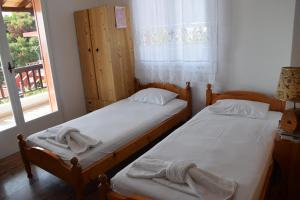 Postel nebo postele na pokoji v ubytování Dimitra's Apartment