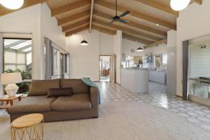 a living room with a couch and a kitchen at Seven Views in Clifton Springs