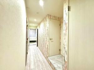 a corridor of a room with a door and a wall at 幸 in Osaka +75 photos