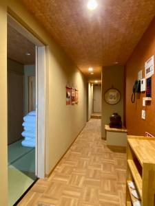 a hallway of a hospital with a room with a ceiling at 姫路城下町 巡 in Himeji