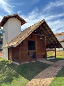 a large wooden building with a pitched roof at Chalés Champion Capitolio in Capitólio +54 photos