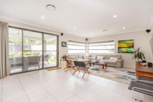 a living room with a couch and a table at Charming 3-Bed Getaway with Pool & Garden Oasis in Lyons