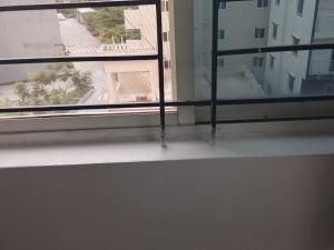 a window with a view of a city street at Pemmis living space in Bangalore