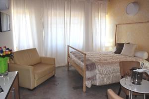 Postel nebo postele na pokoji v ubytování Hotel Quadrifoglio