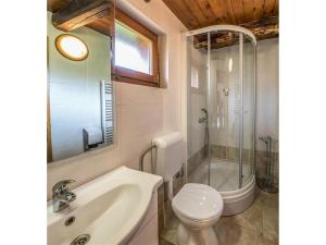a bathroom with a sink and a toilet and a shower at Nature Escape with Pool & Garden Views in Karlovac