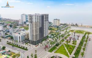 an overhead view of a city with a tall building at Homestay The Pathway Sầm Sơn in Sầm Sơn