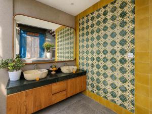 a bathroom with two sinks and a mirror at Mountain Healing Villa by Nagisa Bali in Baturiti +28 photos