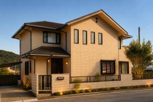 a house on a street at ゲストハウスガーデンズmihama in Wada
