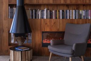a living room with a chair and a fireplace at Anye Seaview Hotel Dali in Dali