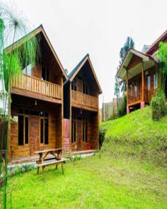 a house on a hill with a picnic table in front of it at Cozzy Villa RB in Citere