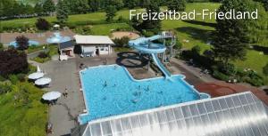 an aerial view of a water park with a water slide at Auszeit in Friedland