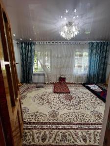 a room with a large rug on the floor at Aida in Tebykty