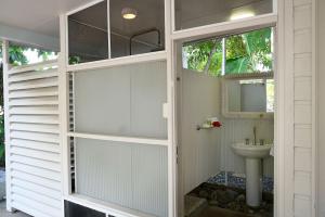 a bathroom with a toilet and a sink at Seasons at South Mission Beach in South Mission Beach +35 photos