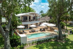 an aerial view of a house with a swimming pool and trees at Latitude 17 Suite 2 in South Mission Beach