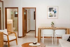 a living room with a table and chairs at Latitude 17 Suite 4 in South Mission Beach