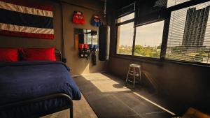 a bedroom with a bed and a flag on the wall at Cinematique Boutique Cinema Hotel in Bangkok +45 photos