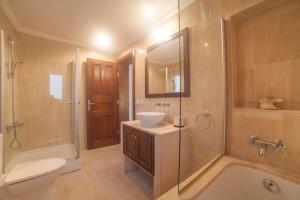 a bathroom with a sink and a toilet and a shower at Luxury Villa Caretta in Kaş +22 photos