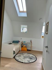 a bedroom with a bed and a rug on the floor at Elegant Manor House in Tongeren