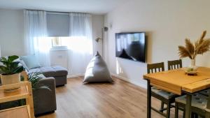 a living room with a couch and a table at פינה בנחלה in Ma'ale Gamla