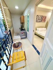 a room with a table and chairs and a bed at Huko House in Ho Chi Minh City