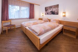 Postel nebo postele na pokoji v ubytování Helvetia Apartments