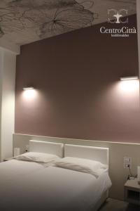 Postel nebo postele na pokoji v ubytování Centro Città Luxury B&B