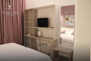 Postel nebo postele na pokoji v ubytování Centro Città Luxury B&B