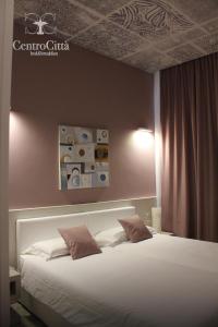 Postel nebo postele na pokoji v ubytování Centro Città Luxury B&B