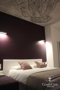 Postel nebo postele na pokoji v ubytování Centro Città Luxury B&B