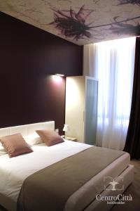 Postel nebo postele na pokoji v ubytování Centro Città Luxury B&B