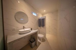 a bathroom with a sink and a toilet at Eva Guest House in Canggu +45 photos