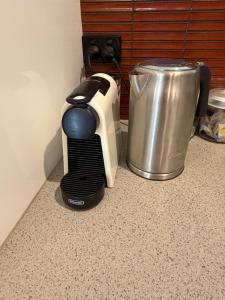 a toaster sitting on a counter next to a trash can at Oasis at Aldinga Beach in Aldinga Beach
