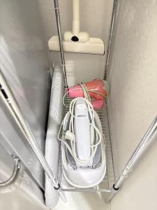 a car is sitting on a shelf in a room at The Scene Fuchinobe in Sagamihara
