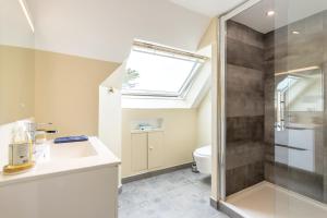 a bathroom with a sink and a shower at Une Chambre À Lestriguiou in Plomeur +14 photos
