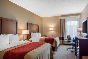 a hotel room with two beds and a flat screen tv at Comfort Inn Chester - Richmond South in Chester
