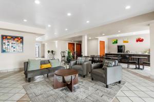 a living room with couches and a table at Quality Inn Laredo - Nuevo Laredo in Laredo