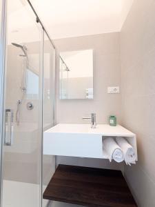 a bathroom with a sink and a shower at Cà in Laguna in Chioggia