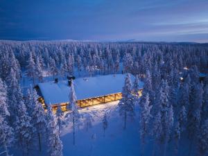 an aerial view of a house in the snow at Wilderness Hotel Saariselkä in Saariselka +74 photos